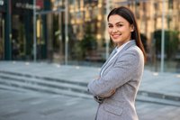 Smiling business woman with crossed arms