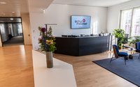 Office reception area, counter, flowers, carpet