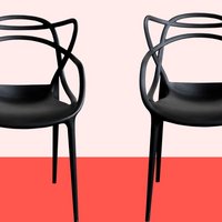 two black armchairs against a red background
